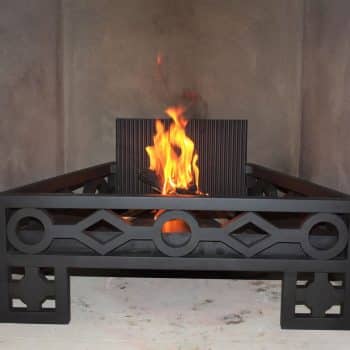 Custom designed fire basket with geometric laser designs and fire back.