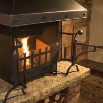 Thermovent with large inglenook canopy and dog irons