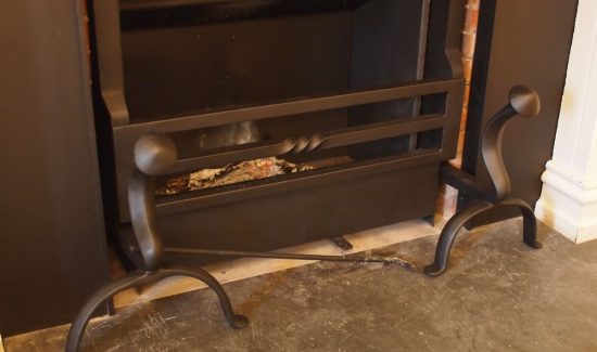 - Short forged cone top dog irons with horse shoe feet Bespoke Fireplaces